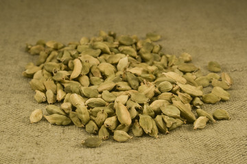 Cardamom fruits on burlap