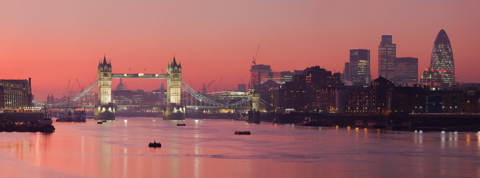 Tower Bridge and city of London with deep red sunset