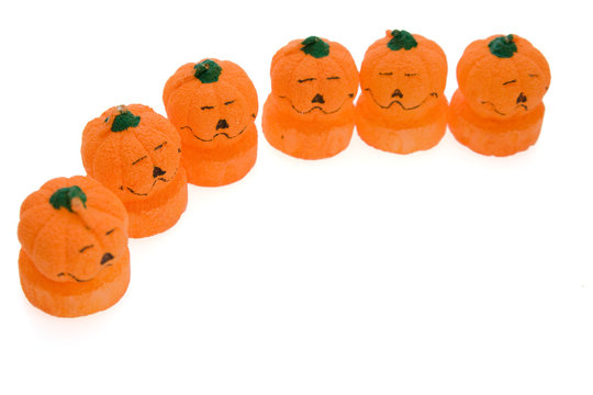 Halloween candles in shape of pumpkin isolated on white