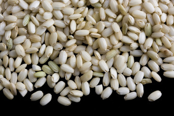 Sweet brown rice on black background