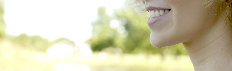 Photo of young Caucasian womanÕs mouth smiling.