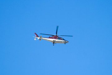 Helicopter on a background of the clear sky