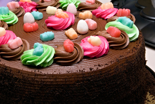 A festive cake colorfully decorated for a party and celebration.