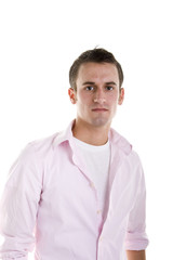 A young man dressed casually in a pink shirt