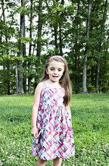Fototapeta premium Beautiful little smiling girl posing