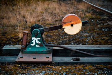 an old and weathered railway track switch