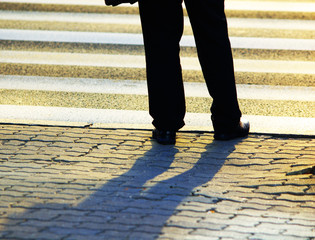 Businessman in front of pedestrian crossing