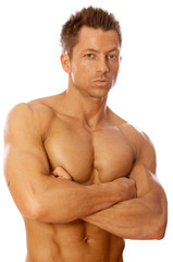 Muscular and tanned male isolated on white