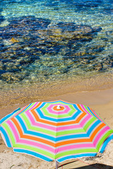 Colorful umbrella on the beach, Portoferraio, Isola d'Elba.