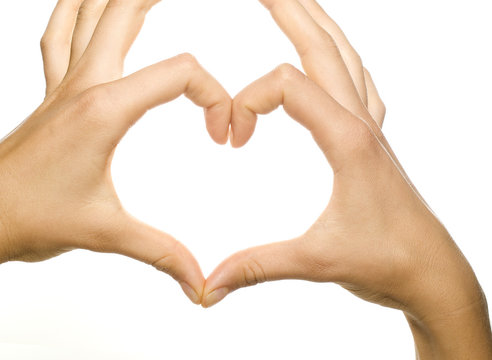 girl's hands forming a heart