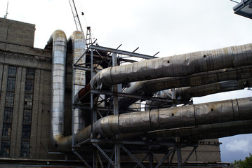 old pipelines on pipe-bridge at abandoned factory