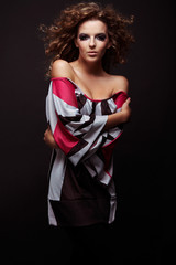 Fototapeta premium beautiful and sexy brunette girl on dark background