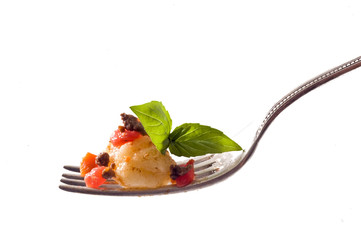 gnocchi on fork isolated on white