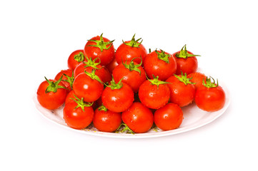 Wet  whole tomatos arranged isolated on white
