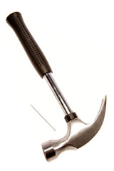 Hammer and nail on white