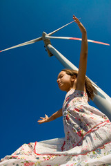 girl in the wind under a turbine