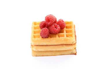 delicious waffles with raspberries isolated on white