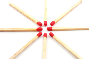 Some red matches isolated on a white background.