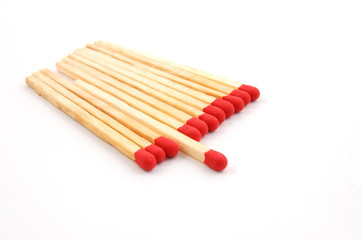 Some red matches isolated on a white background.