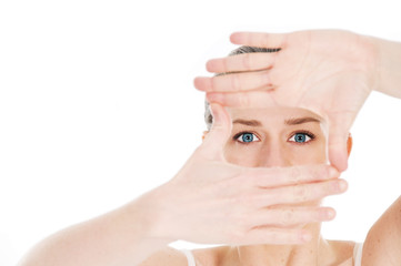blond young woman with blue eyes on white