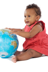 Baby girl with a globe of the world a over white background