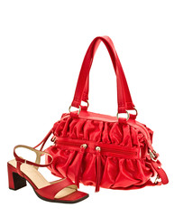 red bag and sandals expressed on white background