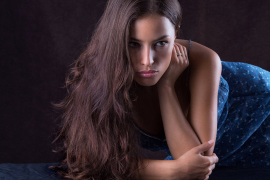 beautiful woman portrait, leaned on the table