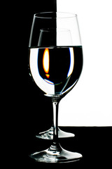 the refraction of the scene in goblet with water.