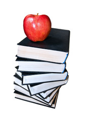 Red apple on top of the book stack