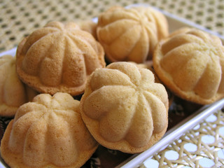 Golden Kueh Bahulu in the traditional buttom-shaped look