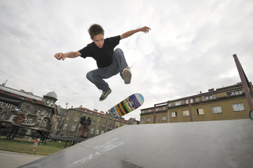 Boy practicing skate in a skate park
