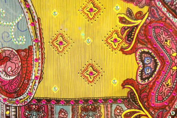 Yellow and red retro Indian pattern with sequins