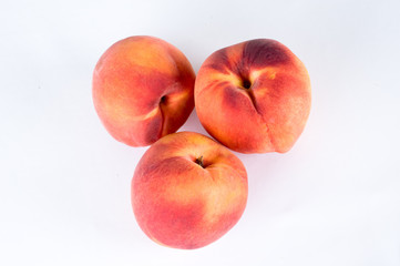 group of 3 peaches on white