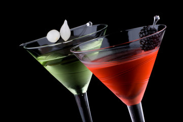 Classical martini in chilled glass over black background