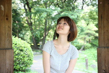 young woman in an arbor