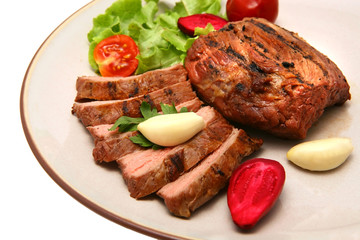 roasted meat steak on color dish