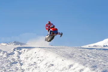 Fotobehang snowmobile © anton yakovlev