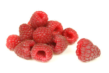 Ripe red raspberries isolated on white background