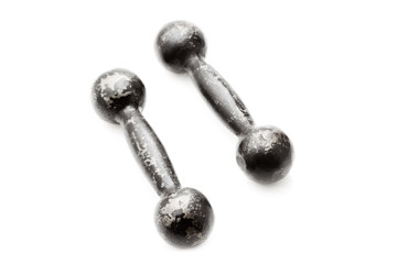 Old dumbbells isolated on a white background