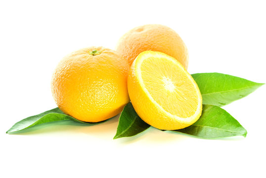 two oranges and half with leaves over white