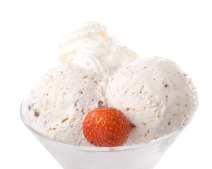 Ice-cream with a strawberries in a glass on a white background.