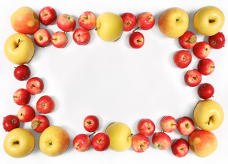 Yellow and red apples against the white background