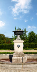 Vintage stone fountain in a country garden
