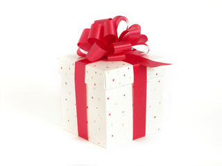 Christmas gift box with red ribbon on white background
