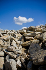 demolished concrete building in front of a blue sky