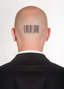Male’s back of head with printed barcode on it