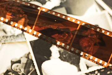 Grunge film strip over old unique photos