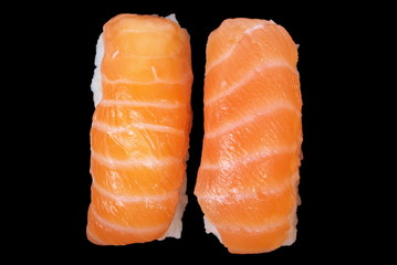 Two nigiri sushi on the black background, isolated.