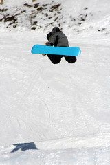 Snowboarder Backside 180 Grab