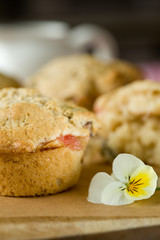 Muffins filled with rhubarb and served on a wooden platter